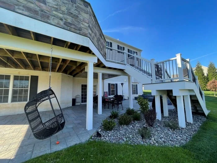 Residential hardscape creation with under deck and subsurface drainage renovation, landscape creation and low voltage lighting addition project in Jamison, PA